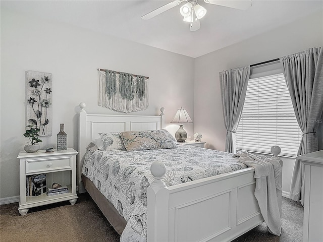 bedroom with dark carpet, baseboards, and a ceiling fan