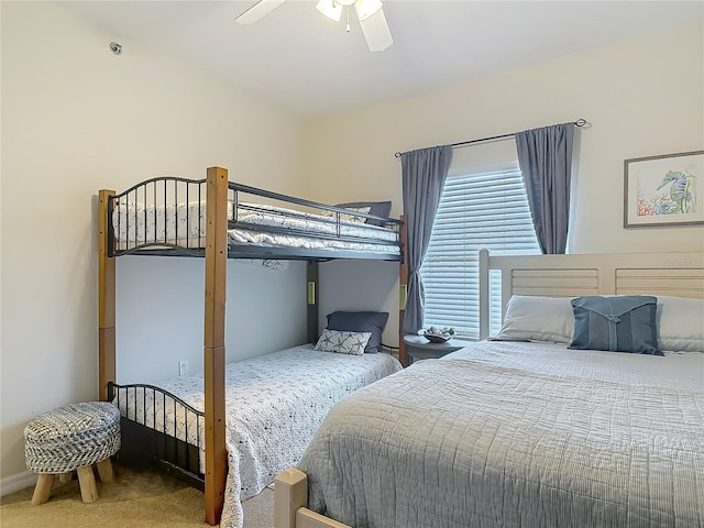 carpeted bedroom with a ceiling fan