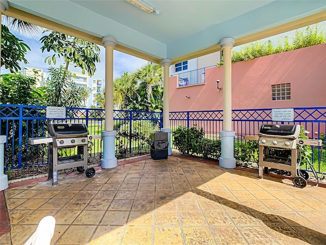view of patio / terrace with grilling area and fence
