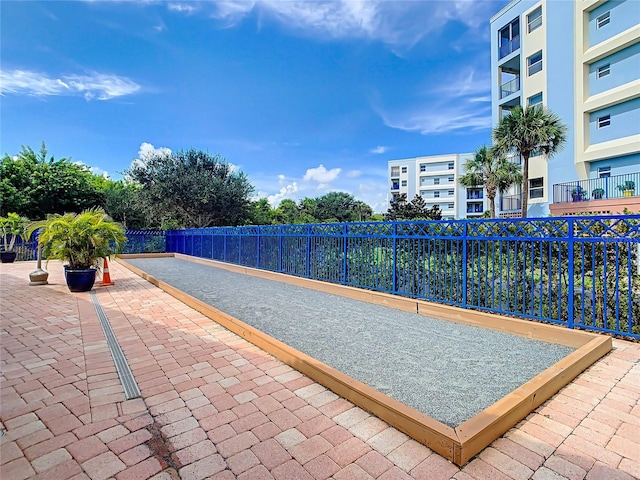 view of community with fence