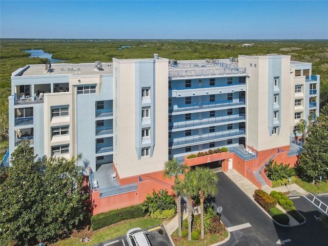 5300 S Atlantic Ave Unit 10-205, New Smyrna Beach, FL 32169 - view of building exterior with uncovered parking