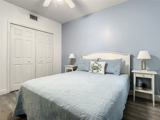 5300 S Atlantic Ave Unit 10-205, New Smyrna Beach, FL 32169 - bedroom with wood finished floors, a closet, visible vents, and baseboards