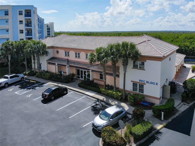 5300 S Atlantic Ave Unit 10-205, New Smyrna Beach, FL 32169 - view of property featuring uncovered parking