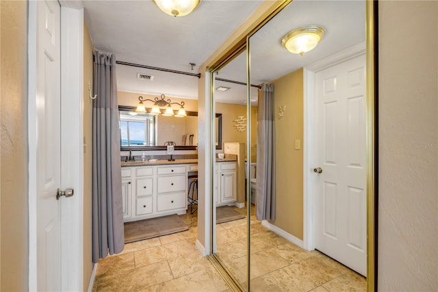 4139 S Atlantic Ave Unit A504, New Smyrna Beach, FL 32169 - full bath featuring visible vents, toilet, and vanity