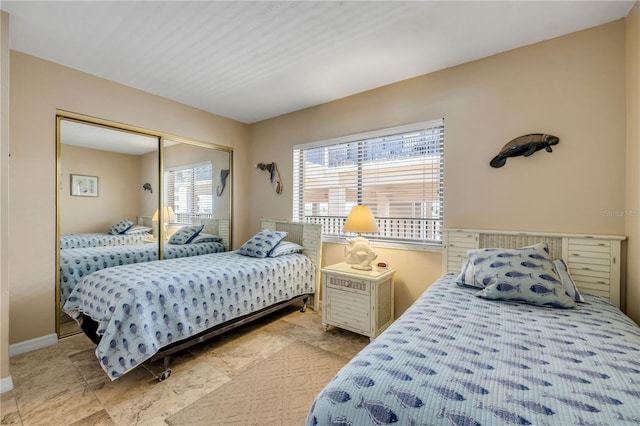 4139 S Atlantic Ave Unit A504, New Smyrna Beach, FL 32169 - bedroom with baseboards and a closet