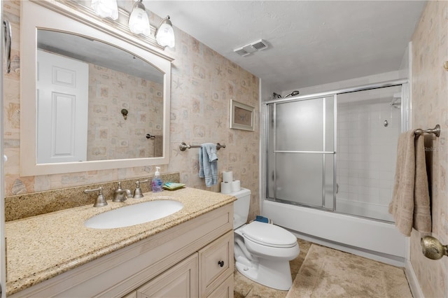 4139 S Atlantic Ave Unit A504, New Smyrna Beach, FL 32169 - bathroom with wallpapered walls, visible vents, vanity, and toilet