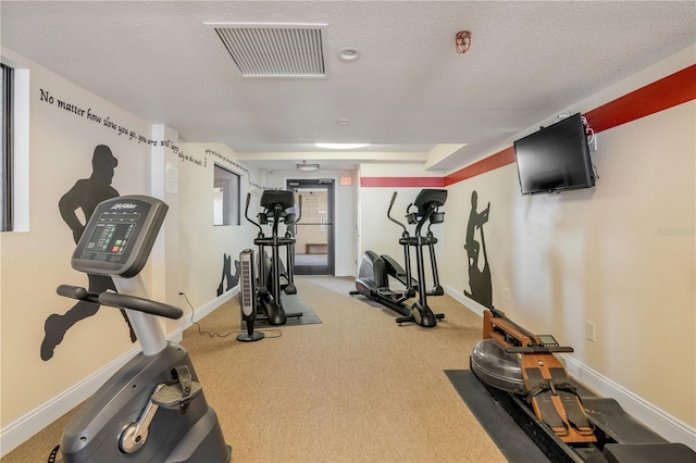 4139 S Atlantic Ave Unit A504, New Smyrna Beach, FL 32169 - workout area featuring carpet floors, visible vents, and baseboards