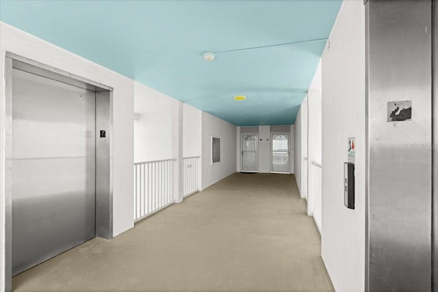 5201 S Atlantic Ave Unit 708A, New Smyrna Beach, FL 32169 - corridor with elevator and finished concrete floors