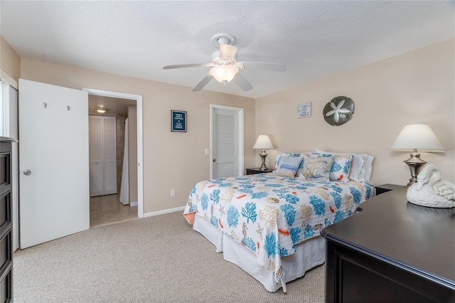 4150 S Atlantic Ave Unit 115D, New Smyrna Beach, FL 32169 - carpeted bedroom featuring baseboards, a closet, and ceiling fan