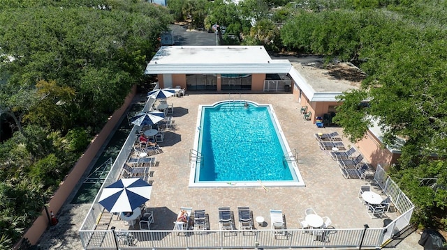 4150 S Atlantic Ave Unit 115D, New Smyrna Beach, FL 32169 - community pool with fence and a patio