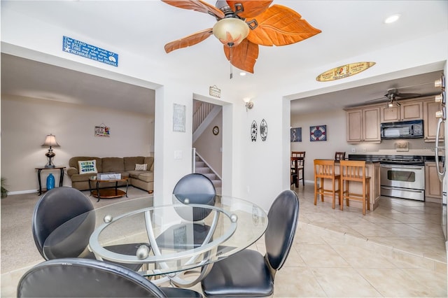 4150 S Atlantic Ave Unit 115D, New Smyrna Beach, FL 32169 - dining space with recessed lighting, stairway, light tile patterned floors, baseboards, and ceiling fan