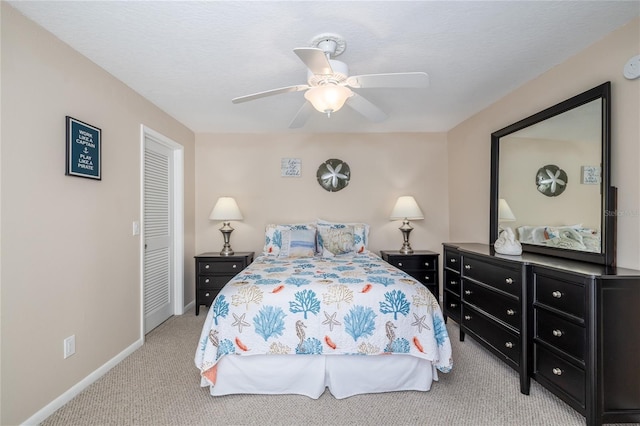 4150 S Atlantic Ave Unit 115D, New Smyrna Beach, FL 32169 - carpeted bedroom featuring a ceiling fan, baseboards, and a closet