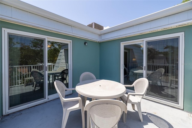 4150 S Atlantic Ave Unit 115D, New Smyrna Beach, FL 32169 - view of patio / terrace featuring outdoor dining area