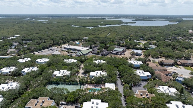 4150 S Atlantic Ave Unit 115D, New Smyrna Beach, FL 32169 - drone / aerial view with a view of trees, a water view, and a residential view