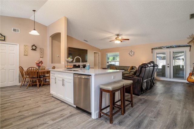 2204 Kumquat Dr, Edgewater, FL 32141 - kitchen with visible vents, stainless steel dishwasher, vaulted ceiling, a sink, and open floor plan