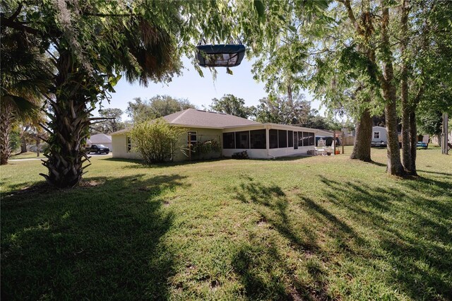 2204 Kumquat Dr, Edgewater, FL 32141 - view of yard with a sunroom