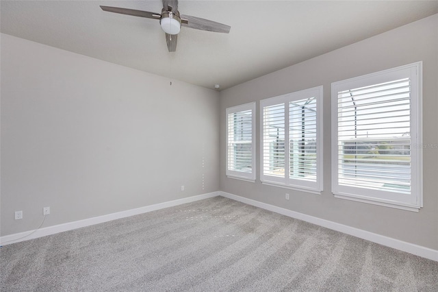 6277 W Fallsgrove Ln, Port Orange, FL 32128 - spare room featuring light carpet, baseboards, and a ceiling fan