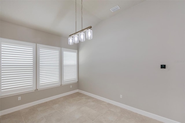 6277 W Fallsgrove Ln, Port Orange, FL 32128 - spare room with vaulted ceiling, visible vents, and baseboards