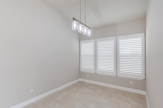 6277 W Fallsgrove Ln, Port Orange, FL 32128 - spare room featuring lofted ceiling and baseboards