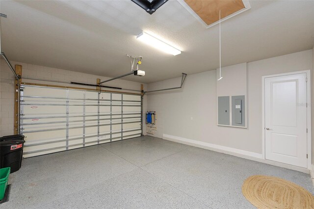 6277 W Fallsgrove Ln, Port Orange, FL 32128 - garage with baseboards, electric panel, and a garage door opener