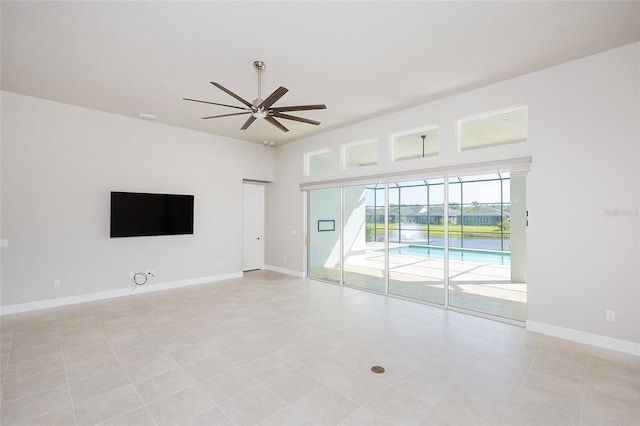 6277 W Fallsgrove Ln, Port Orange, FL 32128 - empty room featuring baseboards, ceiling fan, and light tile patterned flooring