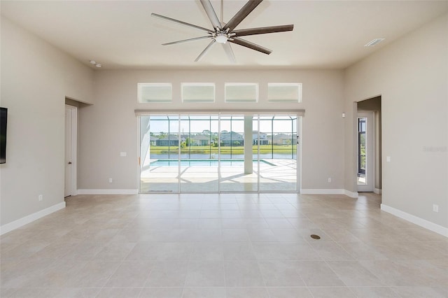 6277 W Fallsgrove Ln, Port Orange, FL 32128 - spare room with light tile patterned floors, baseboards, a ceiling fan, and visible vents