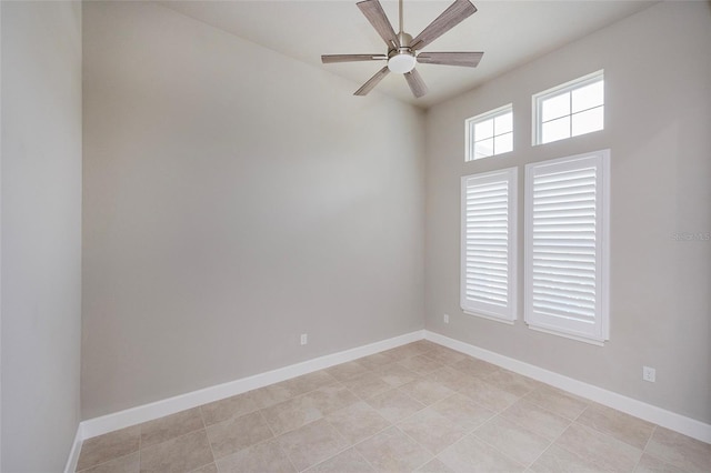 6277 W Fallsgrove Ln, Port Orange, FL 32128 - spare room featuring light tile patterned flooring, baseboards, and a ceiling fan