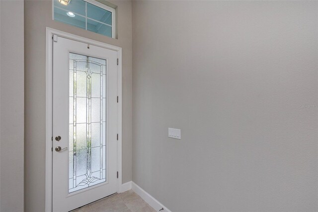 6277 W Fallsgrove Ln, Port Orange, FL 32128 - doorway to outside featuring plenty of natural light, baseboards, and light tile patterned floors