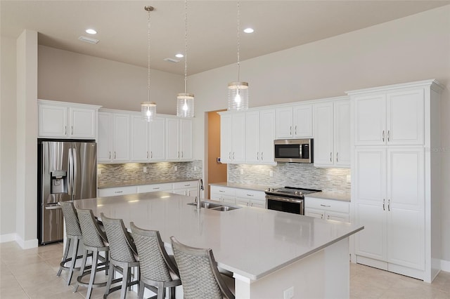 6277 W Fallsgrove Ln, Port Orange, FL 32128 - kitchen with light tile patterned flooring, a sink, white cabinetry, decorative backsplash, and appliances with stainless steel finishes