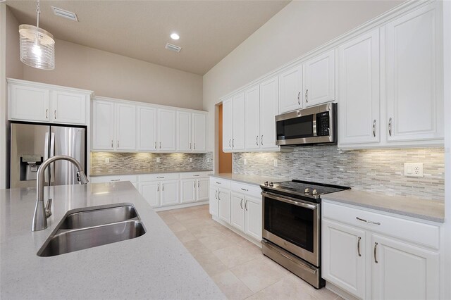 6277 W Fallsgrove Ln, Port Orange, FL 32128 - kitchen featuring white cabinetry, stainless steel appliances, and a sink