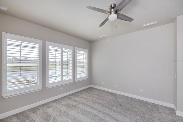 6277 W Fallsgrove Ln, Port Orange, FL 32128 - carpeted empty room featuring baseboards, visible vents, and a ceiling fan
