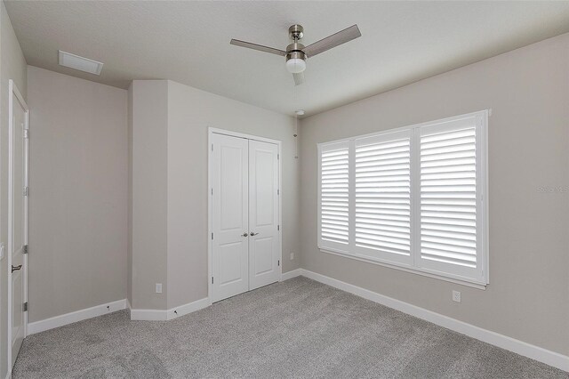 6277 W Fallsgrove Ln, Port Orange, FL 32128 - unfurnished bedroom featuring carpet, visible vents, baseboards, and a closet