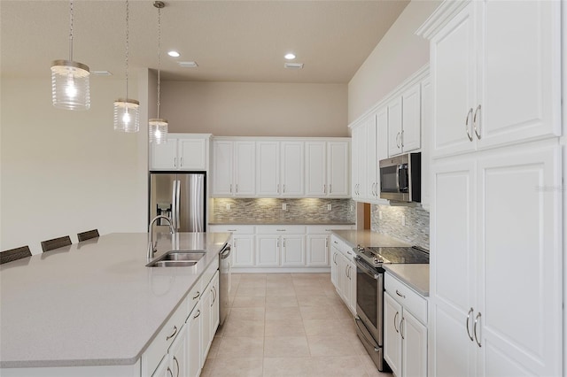6277 W Fallsgrove Ln, Port Orange, FL 32128 - kitchen with a sink, pendant lighting, a center island with sink, backsplash, and appliances with stainless steel finishes