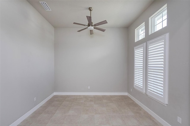 6277 W Fallsgrove Ln, Port Orange, FL 32128 - unfurnished room with ceiling fan, baseboards, light tile patterned floors, and visible vents