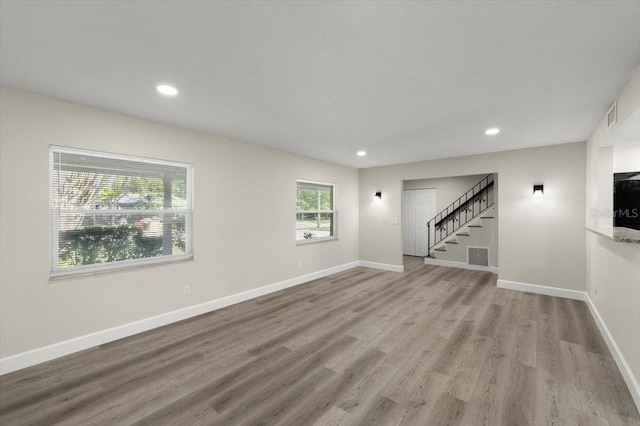 3644 Dame St, Port Orange, FL 32129 - interior space with recessed lighting, wood finished floors, visible vents, and stairs