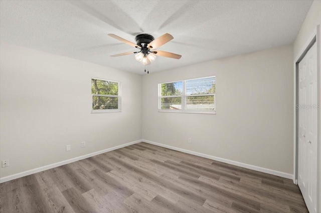 3644 Dame St, Port Orange, FL 32129 - unfurnished bedroom featuring baseboards, wood finished floors, and a closet