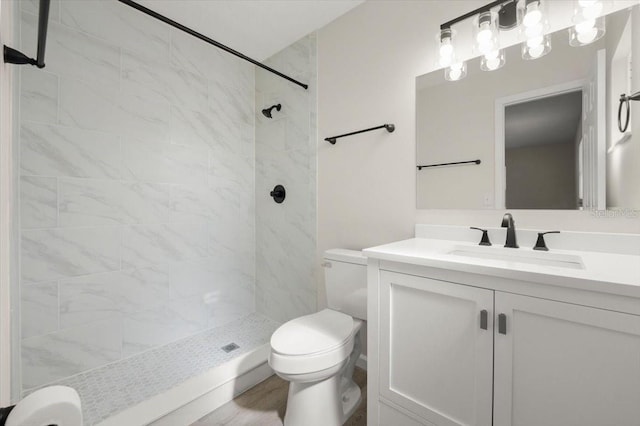 3644 Dame St, Port Orange, FL 32129 - bathroom featuring a tile shower, toilet, and vanity
