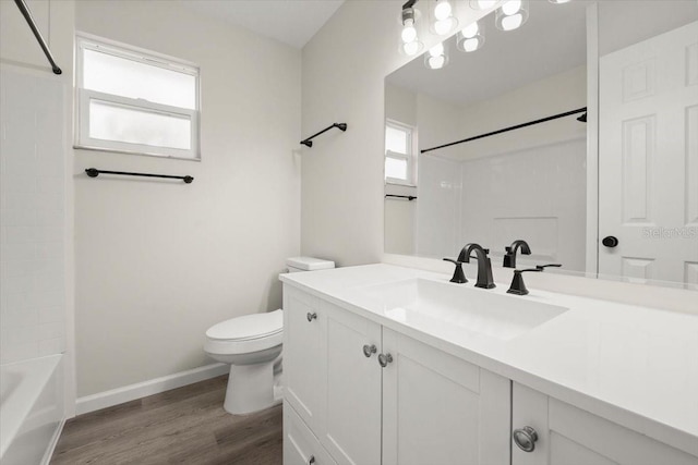 3644 Dame St, Port Orange, FL 32129 - bathroom featuring  shower combination, toilet, baseboards, wood finished floors, and vanity