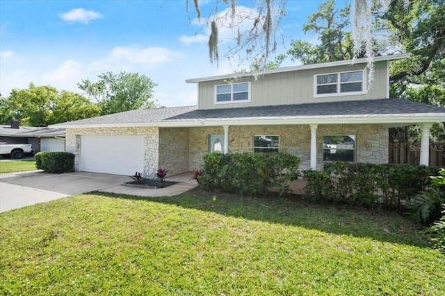 3644 Dame St, Port Orange, FL 32129 - traditional-style house featuring an attached garage, stone siding, a front lawn, and concrete driveway