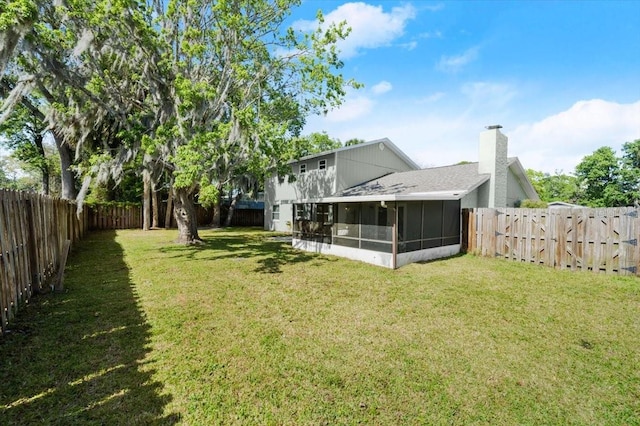 3644 Dame St, Port Orange, FL 32129 - view of yard featuring a fenced backyard and a sunroom
