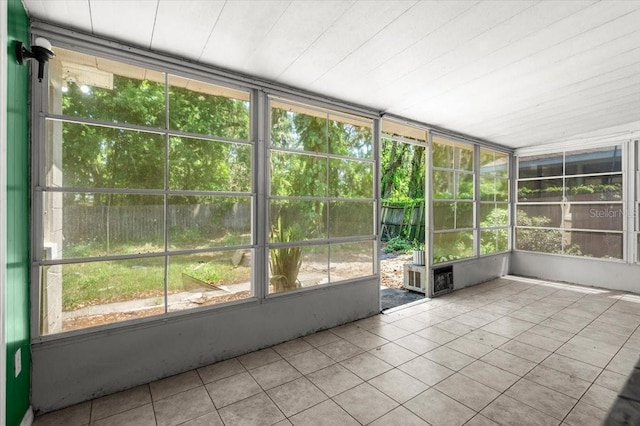 unfurnished sunroom with a healthy amount of sunlight