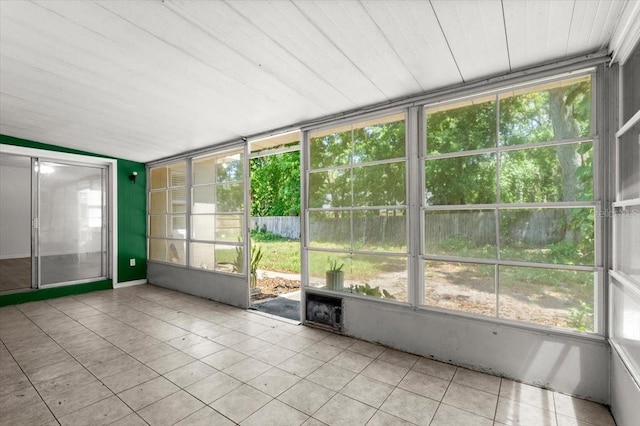 unfurnished sunroom featuring plenty of natural light