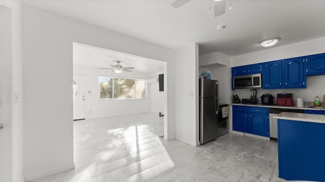 557 Berkshire Rd, Daytona Beach, FL 32114 - kitchen featuring blue cabinets, stainless steel appliances, a ceiling fan, and light countertops