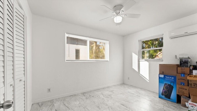 557 Berkshire Rd, Daytona Beach, FL 32114 - interior space with marble finish floor, an AC wall unit, and baseboards