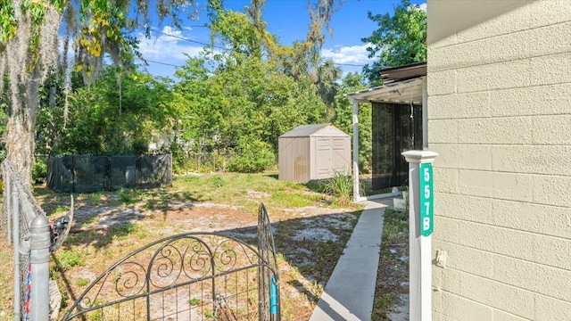 557 Berkshire Rd, Daytona Beach, FL 32114 - view of yard featuring an outbuilding, a shed, and fence