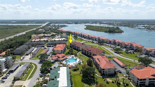 bird's eye view with a residential view and a water view