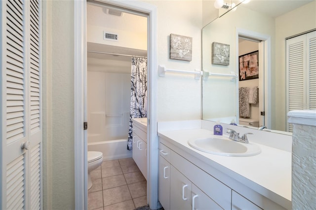 full bathroom with tile patterned floors, toilet, visible vents, a closet, and vanity