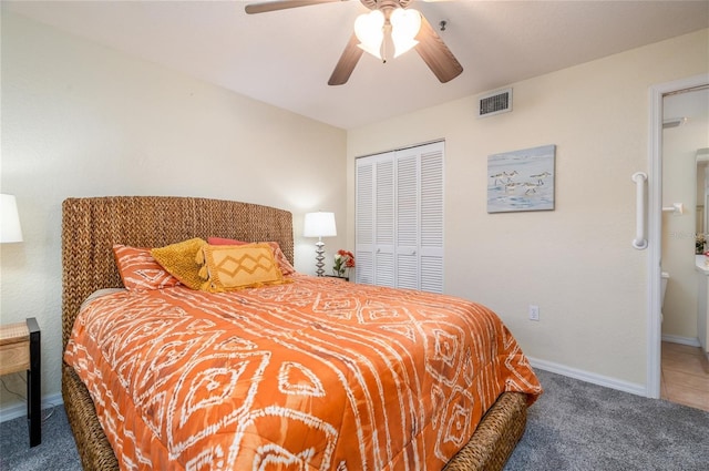 bedroom featuring baseboards, visible vents, carpet, a closet, and ceiling fan