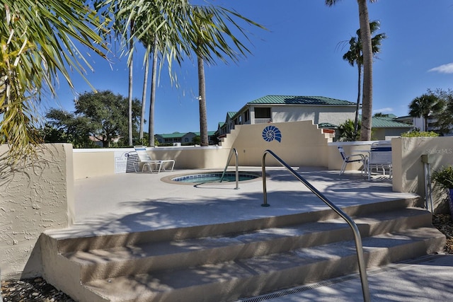 view of swimming pool with a patio area