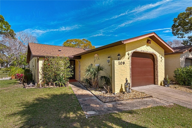 109 Shangri La Cir, Edgewater, FL 32132 - ranch-style house featuring a garage, driveway, a front yard, and stucco siding